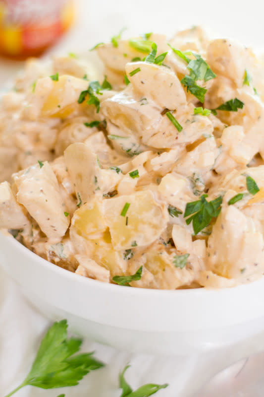 <p>Back to Her Roots</p><p>A little bit spicy, a lot a bit flavorful, this potato salad has a bit of everything.</p><p><strong>Get the recipe: <a href="http://backtoherroots.com/2015/06/30/buffalo-blue-cheese-potato-salad/" rel="nofollow noopener" target="_blank" data-ylk="slk:Buffalo Blue Cheese Potato Salad;elm:context_link;itc:0;sec:content-canvas" class="link rapid-noclick-resp">Buffalo Blue Cheese Potato Salad</a></strong></p><p><strong>Related: <a href="https://parade.com/988735/cathypollak/easy-super-bowl-party-food-recipes/" rel="nofollow noopener" target="_blank" data-ylk="slk:15 Easy Super Bowl Finger Food Ideas;elm:context_link;itc:0;sec:content-canvas" class="link rapid-noclick-resp">15 Easy Super Bowl Finger Food Ideas</a></strong></p>