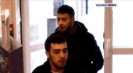 Paris shooting suspect, Salah Abdeslam, and suspected accomplice, Hamza Attou, are seen at a petrol station on a motorway between Paris and Brussels, in Trith-Saint-Leger, France in this still image taken from a November 14, 2015 video provided by BFMTV on January 11, 2016. REUTERS/BFMTV via Reuters TV