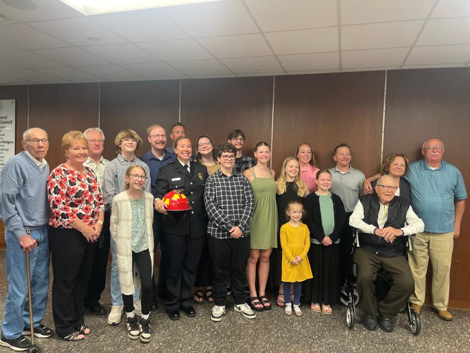 Newly appointed Capt. Erin Tibbs, is joined with her family as they congratulate her on becoming the first female captain in the South Bend Fire Department on April 17, 2024.