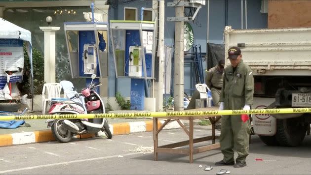 <strong>Police Explosive Ordnance Disposal official inspects the site of a bomb blast in Hua Hin</strong> (Photo: Reuters TV / Reuters)