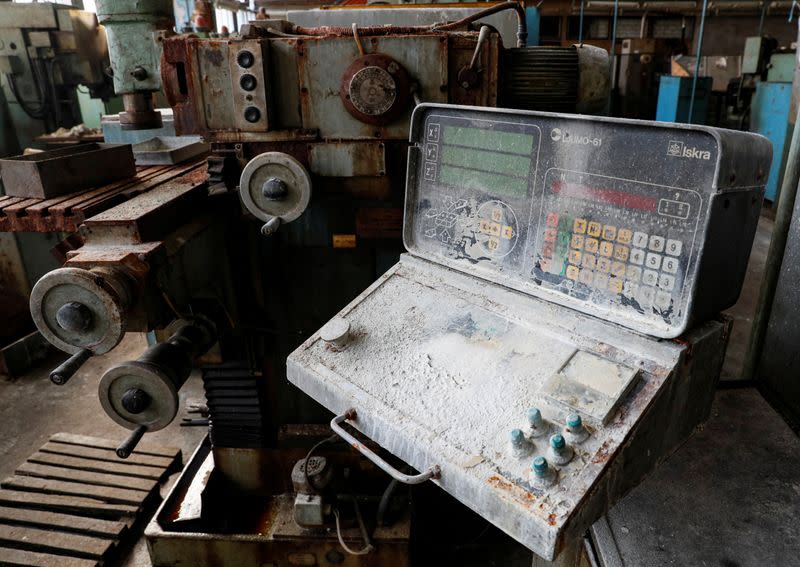 A view shows old corrosion-covered equipment at the disused Burevisnyk state-run military plant in Kiev