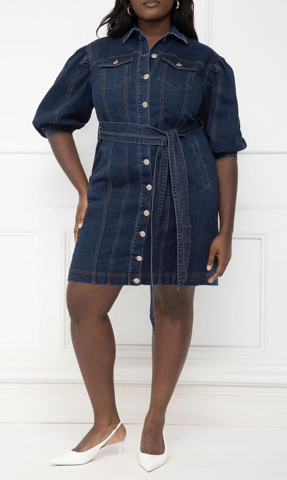 a model wearing the dress in a dark wash denim