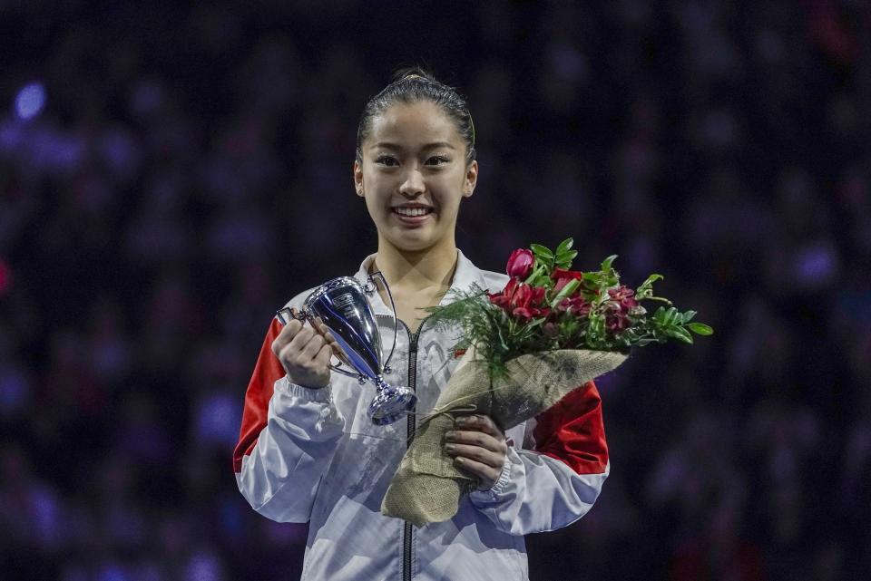 Third place winner Hitomi Hatakeda of Japan poses for a picture after the America Cup gymnastics competition Saturday, March 7, 2020, in Milwaukee. (AP Photo/Morry Gash)