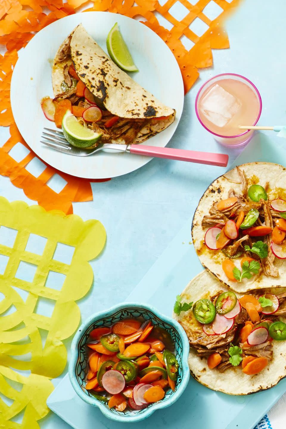 shredded pork, radishes, and carrots on a corn tortilla