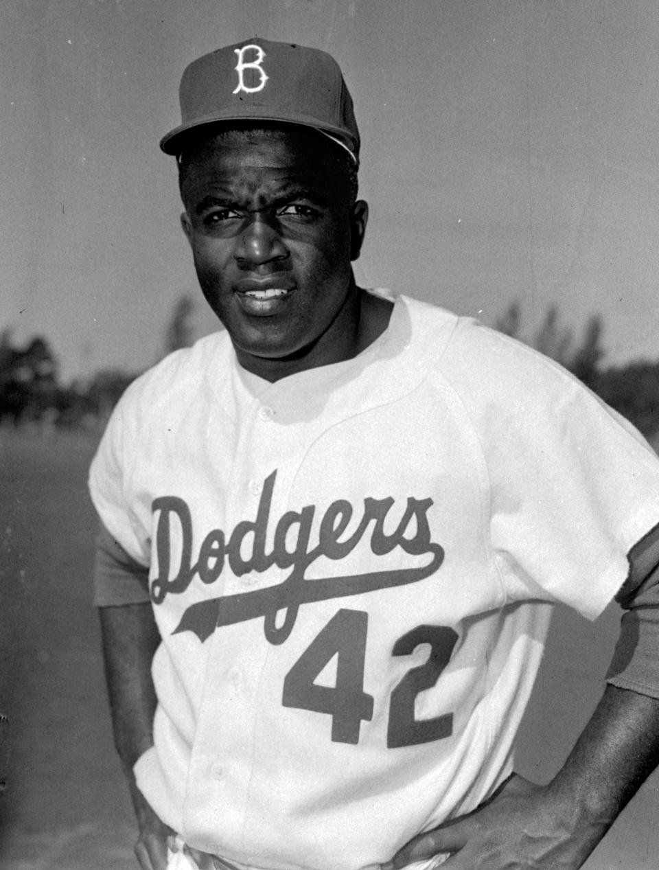 FILE - This is a March 1956 file photo showing Brooklyn Dodgers baseball player Jackie Robinson in Vero Beach, Fla. All players, managers, coaches and umpires will wear No. 42 on Thursday, April 15, 2021, to celebrate Jackie Robinson Day, marking the anniversary of the date the Brooklyn Dodgers Hall of Famer made his Major League Baseball debut and broke the sport's color barrier in 1947. (AP Photo/File)