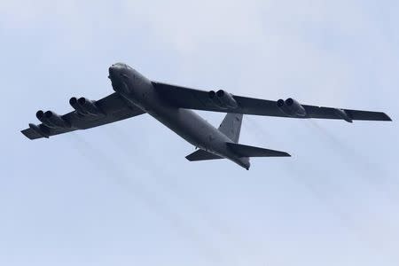 A Boeing B-52 Stratofortress strategic bomber from the United States Air Force (USAF) Andersen Air Force Base in Guam performs a fly-past during an aerial display at the Singapore Airshow in Singapore February 14, 2012. REUTERS/Tim Chong