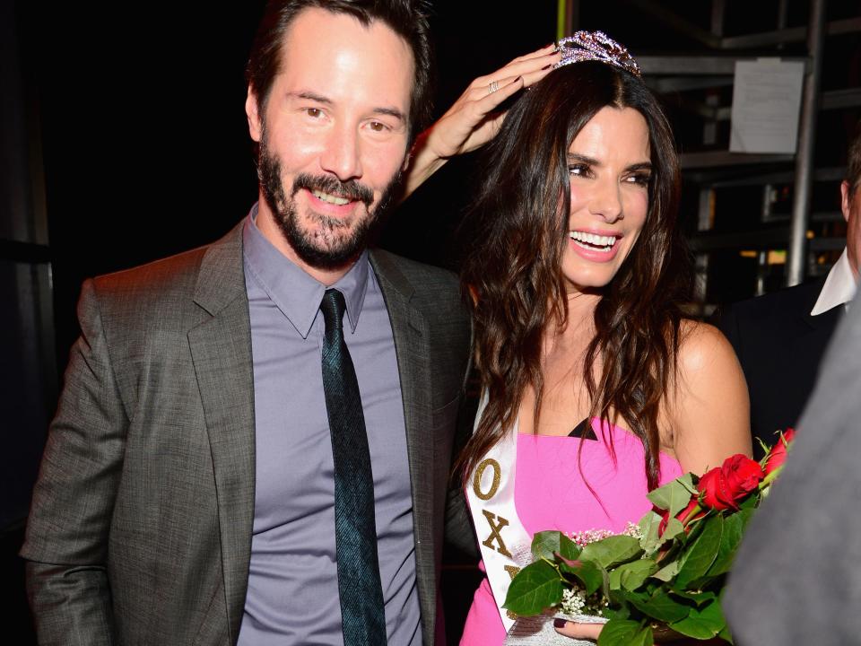 Actors Keanu Reeves (L) and Sandra Bullock speak onstage at Spike TV's "Guys Choice 2014" at Sony Pictures Studios on June 7, 2014