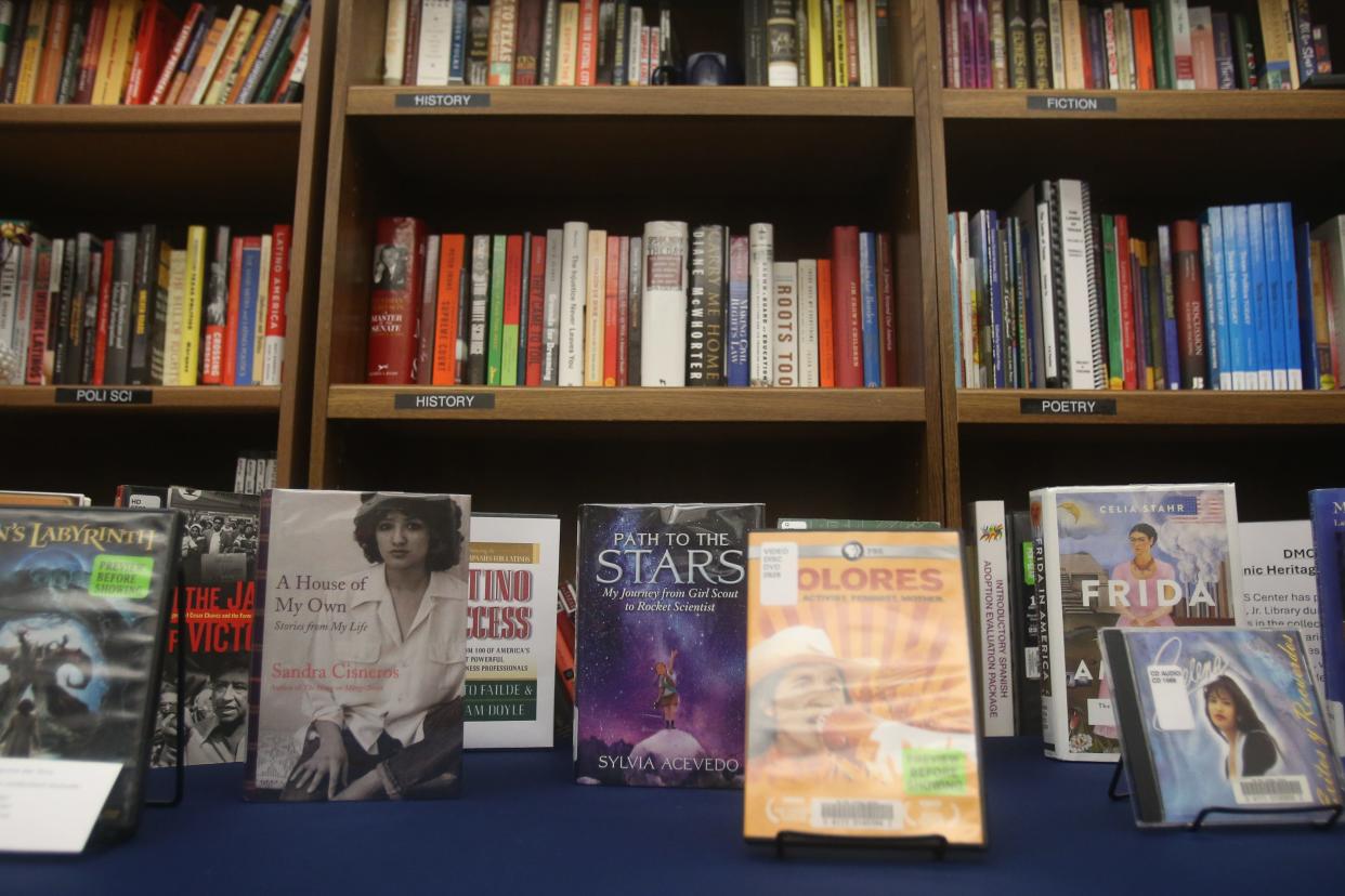 Books by Hispanic authors and about Hispanic people are on display in the Center for Mexican American Studies room at Del Mar College's Heritage Campus on Monday.