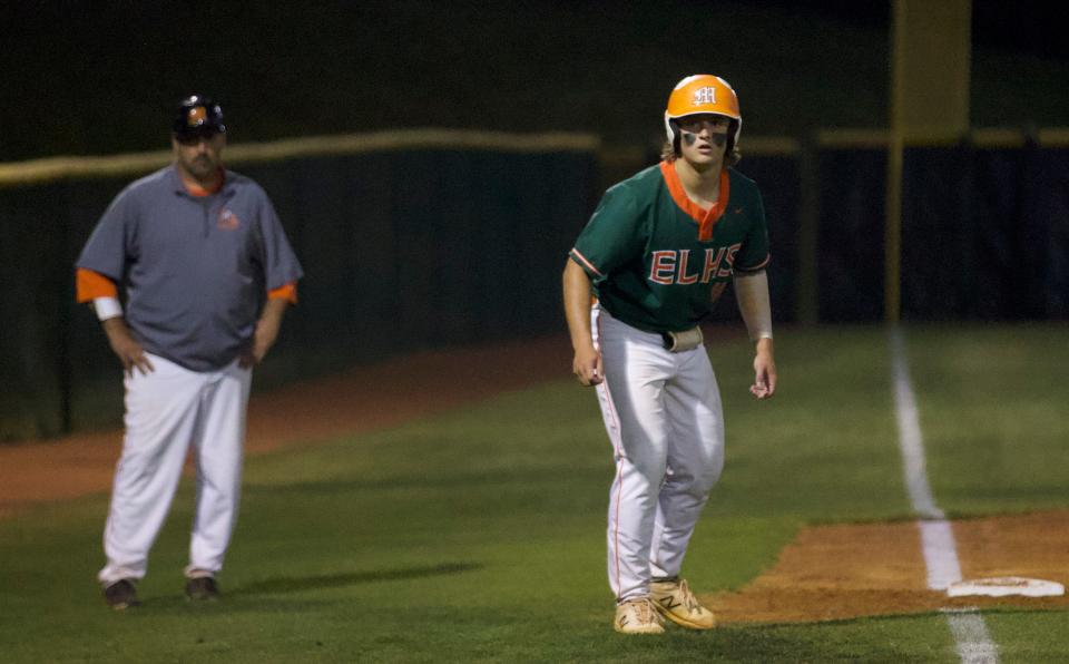 East Lincoln's Garrett Michel watches a pitch make its way toward home plate in his team's playoff win over Forestview in May 2022.