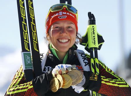 Biathlon - IBU World Championships - Women 12.5 km Mass Start - Hochfilzen, Austria - 19/2/17 - Laura Dahlmeier of Germany displays her medals. REUTERS/Leonhard Foeger