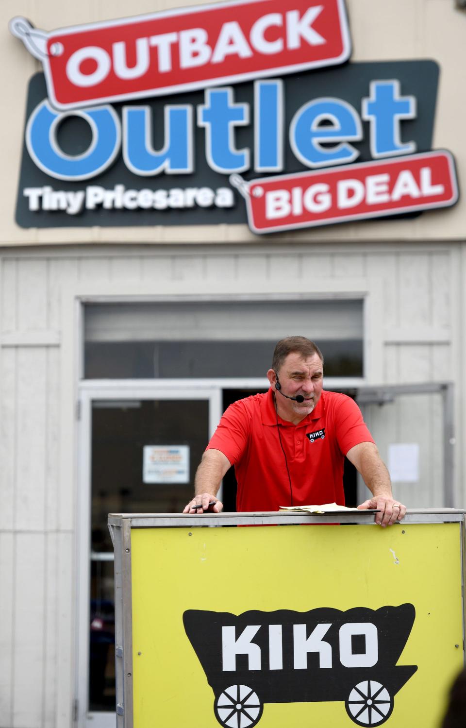 Auctioneer Peter Kiko seeks bids Monday afternoon during the Discount Outlet building and property auction in northeast Massillon.