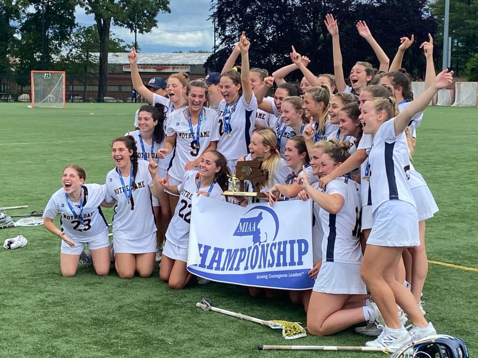 Notre Dame Academy-Hingham celebrates after winning its second consecutive girls lacrosse state champiomship.
