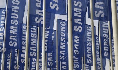 Samsung flags are set up at the main entrance to the Berlin fair ground before the IFA consumer electronics fair in Berlin, August 28, 2012. REUTERS/Tobias Schwarz