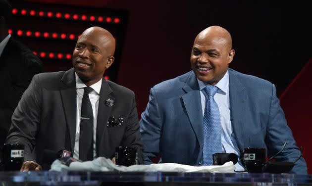 NBA analysts Kenny Smith and Charles Barkley laugh during a live telecast of 