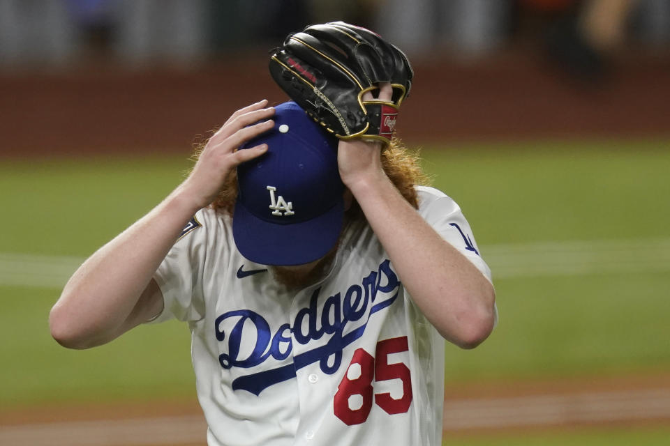 Los Angeles Dodgers starting pitcher Dustin May reacts after giving up a two-run home run to Tampa Bay Rays' Brandon Lowe during the fifth inning in Game 2 of the baseball World Series Wednesday, Oct. 21, 2020, in Arlington, Texas. (AP Photo/Eric Gay)