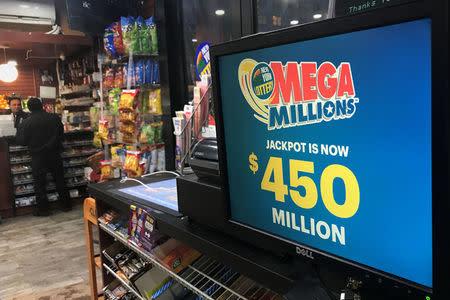 A Mega Millions sign is pictured in a store in New York City, New York, U.S., January 5, 2018. REUTERS/Carlo Allegri