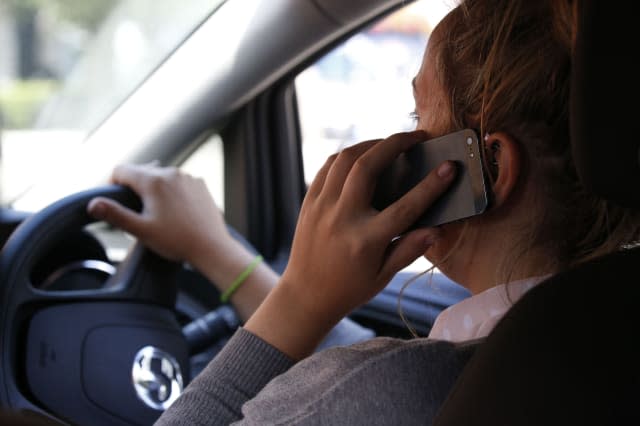 PICTURE POSED BY MODELFile photo dated 13/08/14 of a woman talking on her phone while driving, as nearly 50% of drivers admit breaking traffic laws, with around half of them doing so deliberately, according to a survey. PRESS ASSOCIATION Photo. Issue date: Tuesday April 28, 2015. As many as 49% said they flouted road regulations, the poll from road safety charity Brake and insurance company Direct Line showed. See PA story TRANSPORT Laws. Photo credit should read: Jonathan Brady/PA Wire