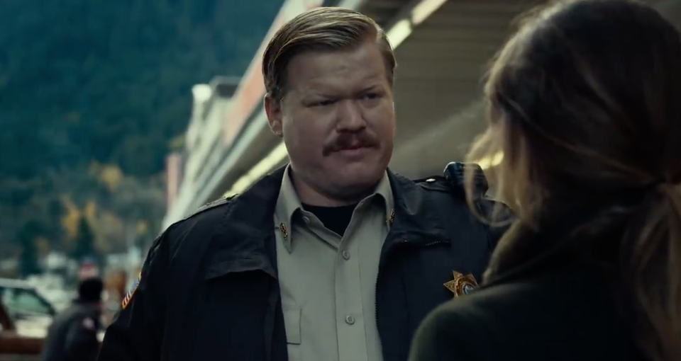 Jesse Plemons as Paul, wearing a sheriff's uniform and a mustache
