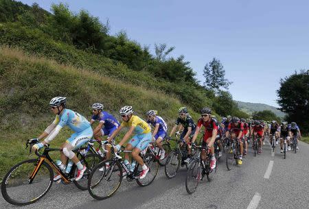 The pack of riders including race leader Astana team rider Vincenzo Nibali of Italy cycles on its way during the 237.5km 16th stage of the Tour de France cycling race between Carcassonne and Bagneres-de-Luchon, July 22, 2014. REUTERS/Jean-Paul Pelissier