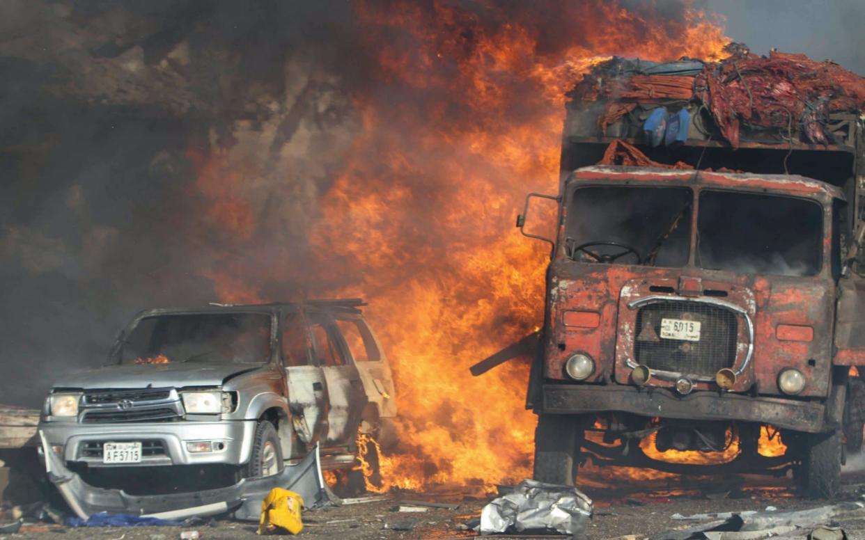 Vehicles burn at the scene of a massive explosion in front of Safari Hotel in the capital Mogadishu, Somalia - EPA