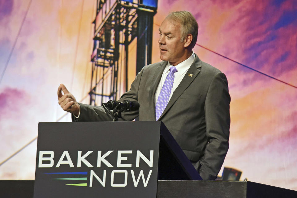 FILE - In this May 23, 2018, file photo, then U.S. Interior Secretary Ryan Zinke speaks at the Williston Basin Petroleum Conference in the Bismarck Event Center in Bismarck, N.D. As former U.S. Interior Secretary Zinke exits Washington amid a cloud of unresolved ethics investigations, he says he has lived up to the conservation ideals of Teddy Roosevelt and insists the myriad allegations against him will be proven untrue. (Tom Stromme/The Bismarck Tribune via AP, File)