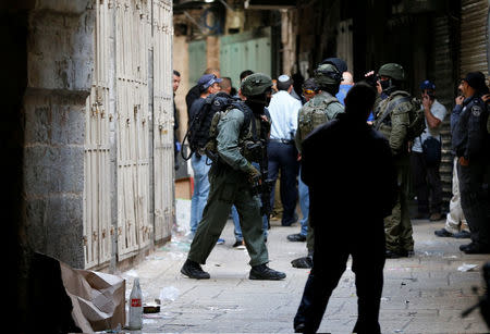 Israeli security forces work at an alley following a stabbing attack inside the old city of Jerusalem Israeli police said, April 1, 2017 REUTERS/Ammar Awad