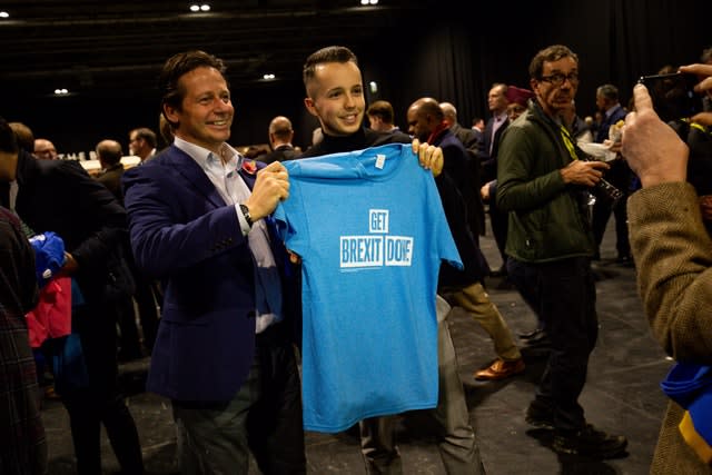 T-shirts are handed out before the Conservative campaign launch for the 2019 General Election at the NEC in Birmingham