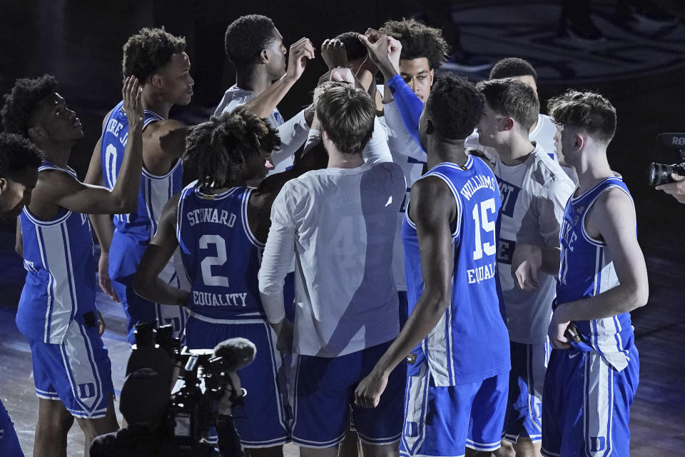 Duke players gather prior to the start of an NCAA college basketball game against Louisville in the second round of the Atlantic Coast Conference tournament in Greensboro, N.C., Wednesday, March 10, 2021. Duke has pulled out of the Atlantic Coast Conference Tournament and ended its season after a positive coronavirus test and the resulting quarantining and contact tracing. The ACC announced that the Blue Devils’ quarterfinal game with Florida State scheduled for Thursday night has been canceled. (AP Photo/Gerry Broome)