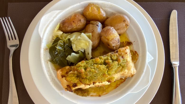 Fish and vegetables in white dish 