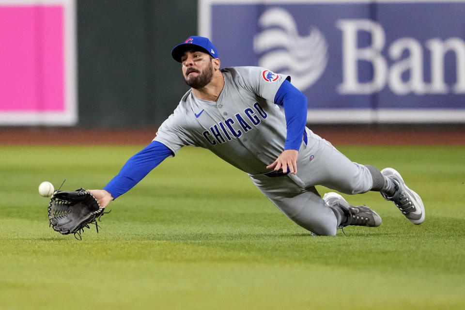 Chicago Cubs' Mike Tauchman fields a fly out hit by Arizona Diamondbacks' Gabriel Moreno during the eighth inning of a baseball game, Monday, April 15, 2024, in Phoenix. (AP Photo/Matt York)