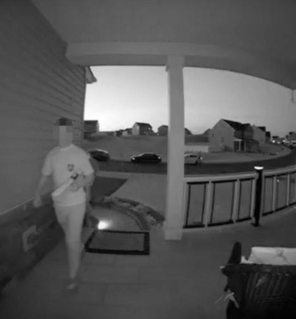 PHOTO: Home security video shows a teen holding what appears to be a toy gun while ringing on Justin Johnson's doorbell on April 26. (Family Handout)