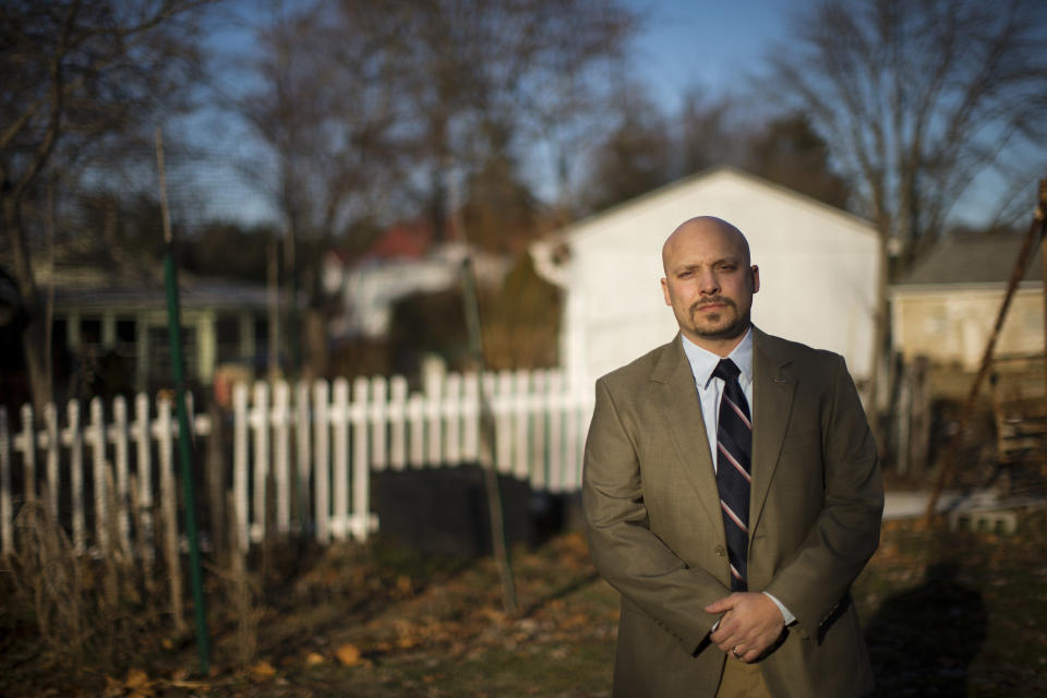 Former Marine Corps scout sniper Earl J. Catagnus Jr., stands for a photograph at his home in Eagleville, Pa. on Wednesday, Jan. 8, 2014. Catagnus fought and bled in the taking of Fallujah. Now an assistant professor of history at Valley Forge Military Academy & College, Catagnus feels the battle has taken on an almost disproportionate importance in the American mind. (AP Photo/Matt Rourke)