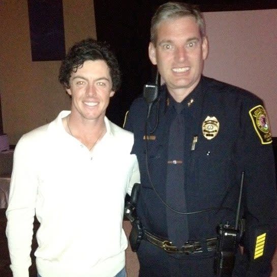 Rory McIlroy poses with Deputy Chief Patrick Rollins