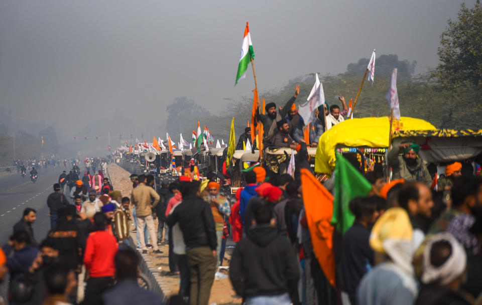 NEW DELHI, INDIA - JANUARY 26: Farmers from Punjab taking out tractor rally in protest against Farm Laws at Singhu Border on occasion of Republic Day on January 26, 2021 in New Delhi, India. Thousands of farmers, who have been camping at Delhi border for the past two months, on Tuesday begun marching towards the national capital to hold their planned tractor rally to mark their dissent against the three agricultural laws cleared by the Centre in September last year.(Photo by Amal Ks/Hindustan Times via Getty Images)