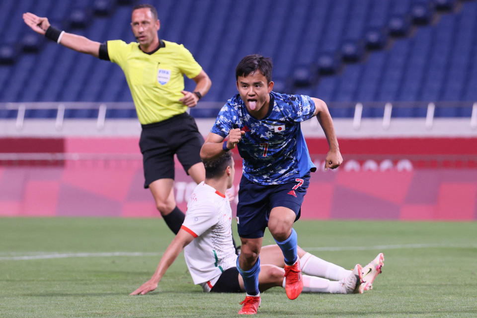 Japan's forward Takefusa Kubo runs to celebrate after scoring the opening goal during the Tokyo 2020 Olympic Games men's group A first round football match between Japan and Mexico at Saitama Stadium in Saitama on July 25, 2021. (Photo by Ayaka Naito / AFP) (Photo by AYAKA NAITO/AFP via Getty Images)