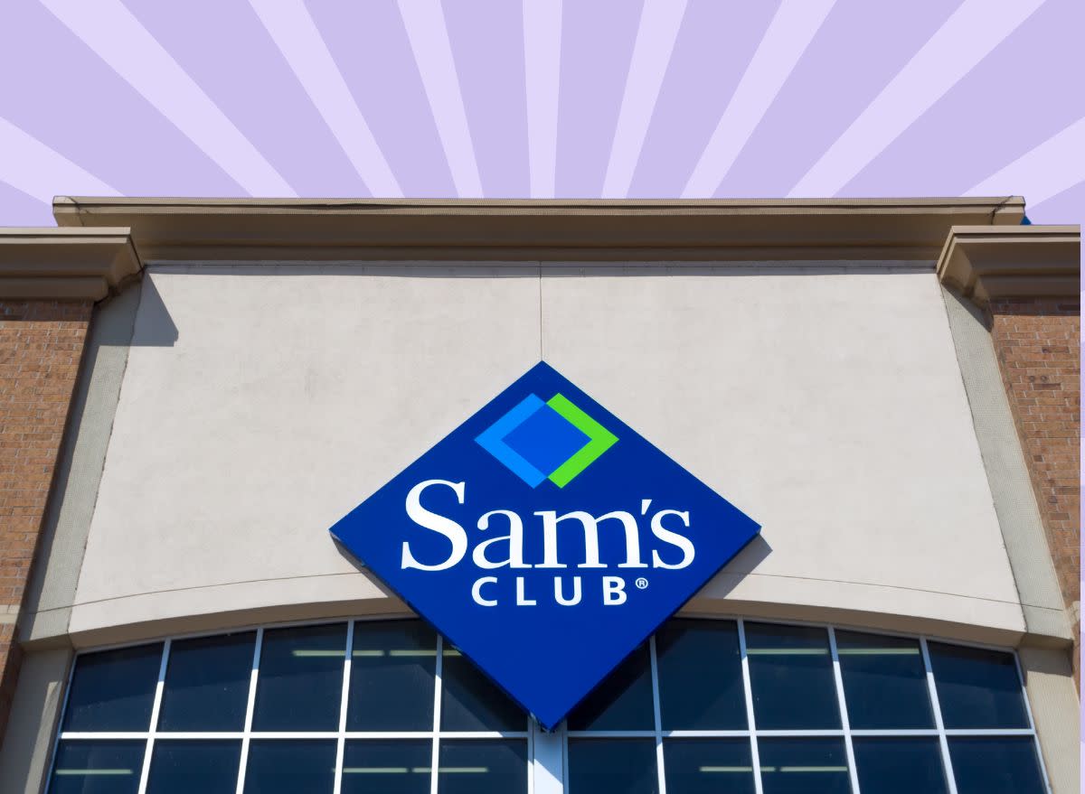 The storefront of a Sam's Club warehouse against a colorful background