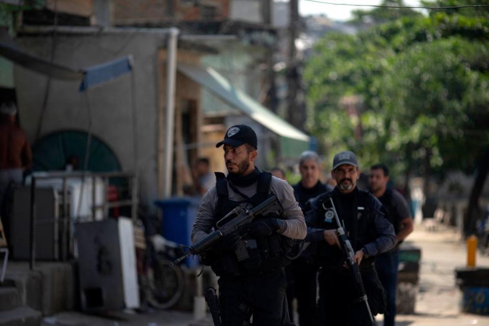 Civil Police officers take part in an operation against alleged drug traffickers at the Jacarezinho favela in Rio de Janeiro, Brazil, on May 06, 2021.<span class="copyright">Photo by MAURO PIMENTEL / AFP</span>