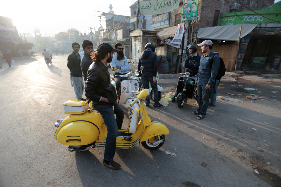 <p>Members of a Vespa rider’s club gather at sunrise for a ride in Lahore, Pakistan March 11, 2018. (Photo: Caren Firouz/Reuters) </p>