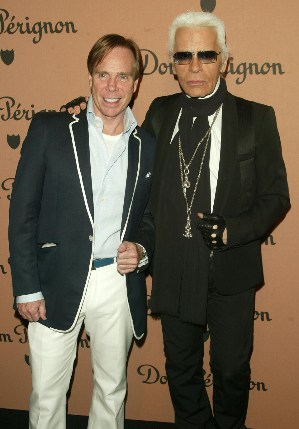 NEW YORK - JUNE 2:  (from left to right) Designers Tommy Hilfiger and Karl Lagerfeld attend the launch party for the new Dom Perignon Vintage 1998 Champagne hosted by Karl Lagerfeld on June 2, 2005 in New York City. (Photo by Peter Kramer/Getty Images)