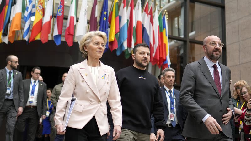 From left, European Commission President Ursula von der Leyen, Ukraine’s President Volodymyr Zelenskyy and European Council President Charles Michel walk together during an EU summit in Brussels on Feb. 9, 2023. The European Union decided on Thursday, Dec. 14, 2023 to open accession negotiations with Ukraine, a stunning reversal for a country at war that had struggled to find the necessary backing for its membership aspirations and long faced opposition from Hungarian Prime Minister Viktor Orban.