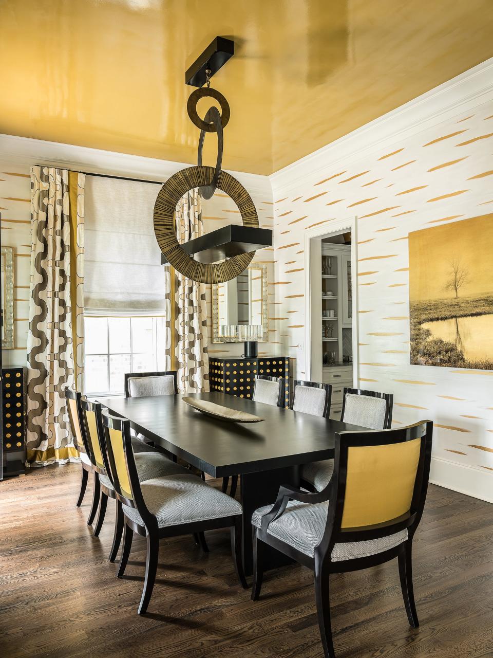 Jonathan Savage chose a dandelion-colored lacquered ceiling for the dining room of a client’s Nashville home to accent the Hervé Van der Straeten light fixture.