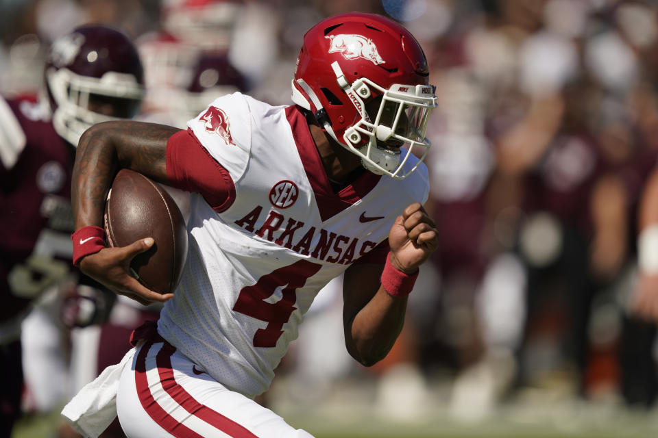 Arkansas quarterback Malik Hornsby (4) runs the ball for a first down against Mississippi State during the first half of an NCAA college football game in Starkville, Miss., Saturday, Oct. 8, 2022. (AP Photo/Rogelio V. Solis)