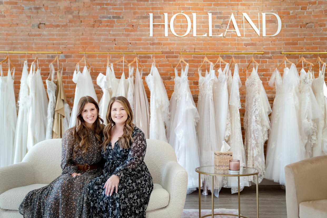 Mallory Gritsch, left, and Bri Buzick sit for a photo at Holland Bridal Shoppe, their new bridal shop in Pella.