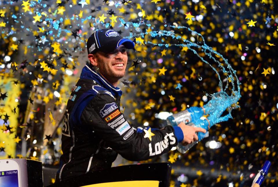 Nov 17, 2013; Homestead, FL, USA; NASCAR Sprint Cup Series driver Jimmie Johnson celebrates in victory lane after winning the Sprint Cup championship after the Ford EcoBoost 400 at Homestead-Miami Speedway. Mandatory Credit: Andrew Weber-USA TODAY Sports