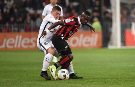 Football Soccer - Nice v Paris St Germain - French Ligue 1 - Allianz Riviera Stadium, Nice, France, 30/04/2017. Paris St Germain's Marco Verratti in action with Nice's Jean Michael Seri. REUTERS/Jean-Pierre Amet