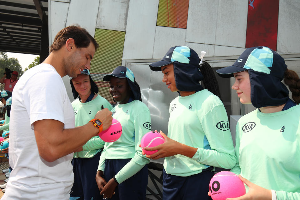 Rafael Nadal signing tennis balls for the Ball Kids ahead of the Australian Open.