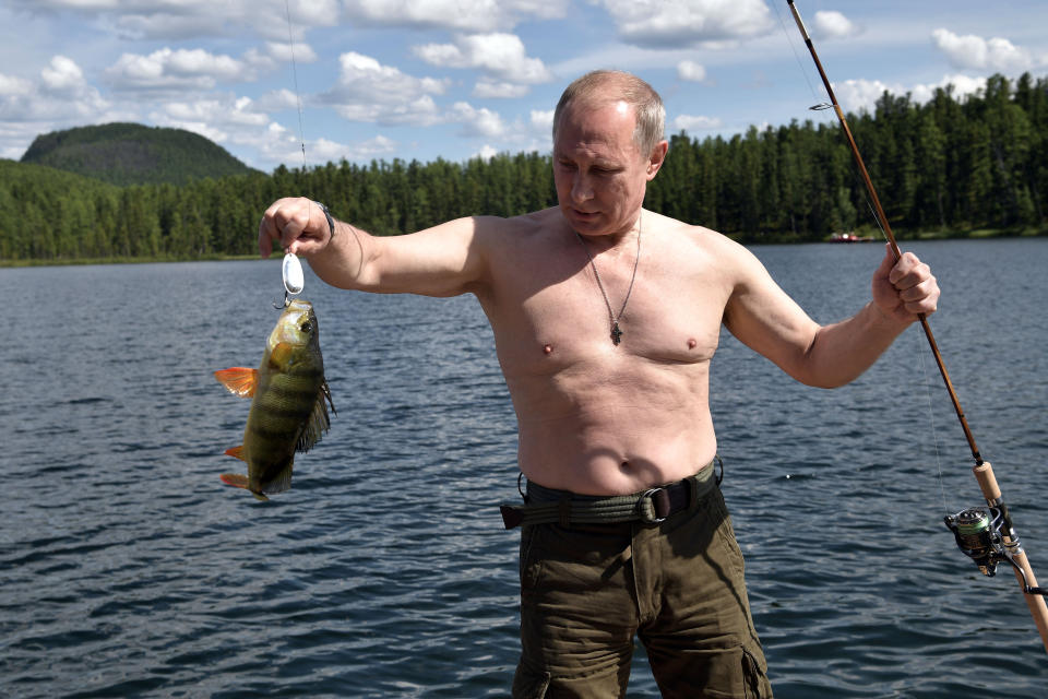 Putin holds a fish he caught during&nbsp;an August 2017 trip to Tyva in southern Siberia.