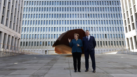 German Chancellor Angela Merkel, left, and Bruno Kahl, President of the BND, pose during the official opening of the Federal Intelligence Service, BND, building in Berlin, Germany, February 8, 2019. Michael Sohn/Pool via Reuters