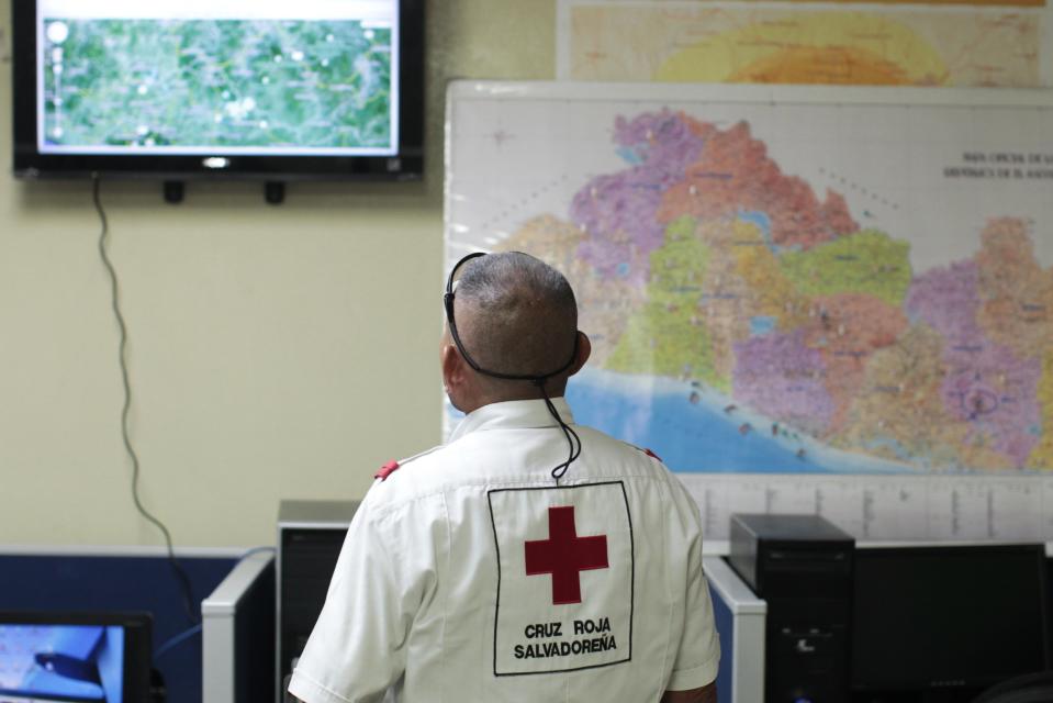 A member of El Salvador's Red Cross observes a screen after a magnitude 7.3 earthquake struck late on Monday, at a Red Cross office in San Salvador October 13, 2014. (REUTERS/Oswaldo Rivas)