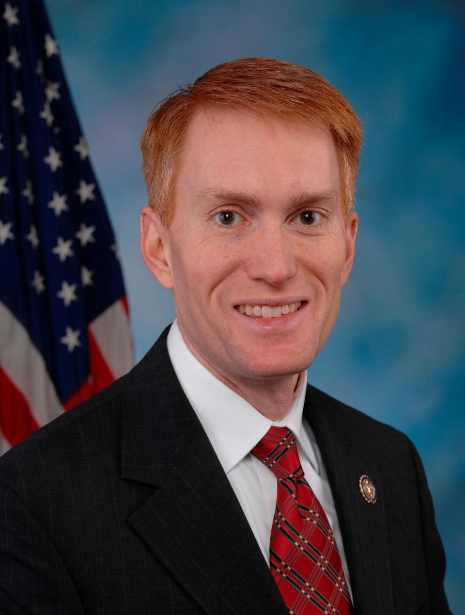 Lankford's bright red hair stands out in the sea of salt-and-pepper congressmen.